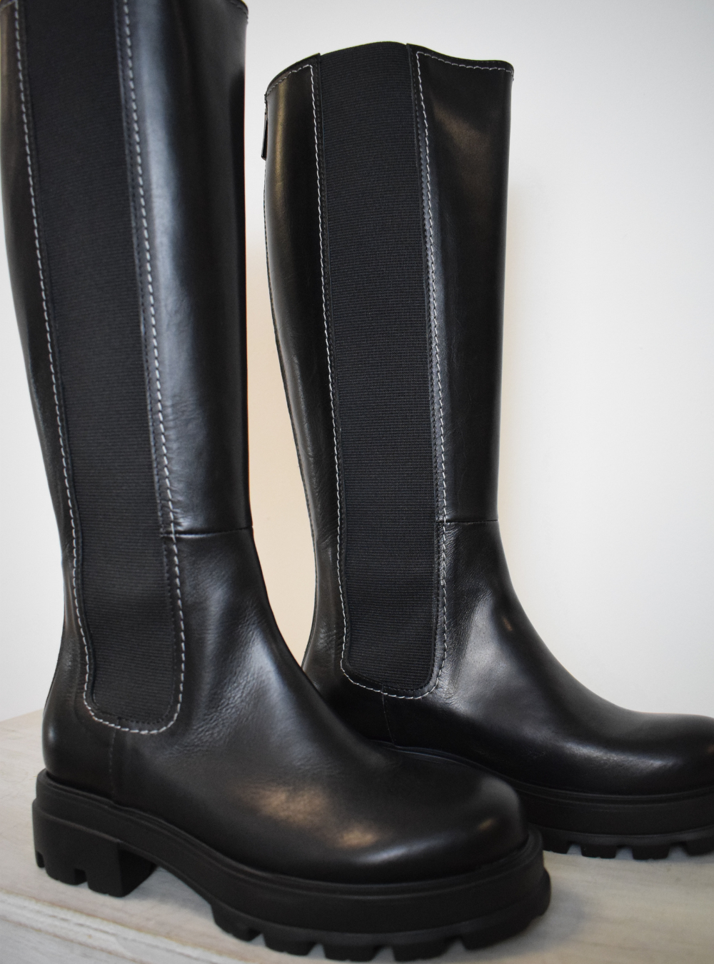 Black boot with white edging 