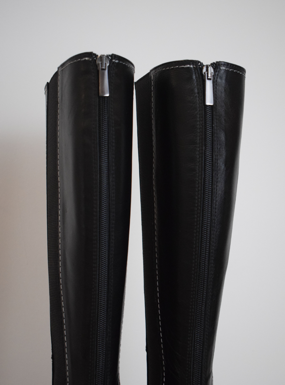 Black boot with white edging 