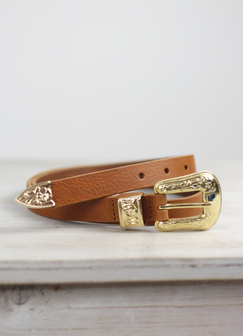The Rosette Belt from Spanish brand Mercules is western inspired style with a gorgeous gold coloured buckle and pointer.  This narrow style looks great worn on a higher waisted trouser and also layers over dresses and knit brilliantly.