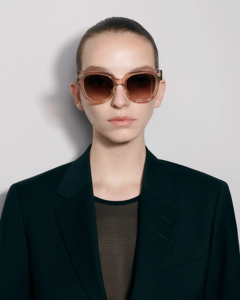 Oversized ecru sunglasses on model