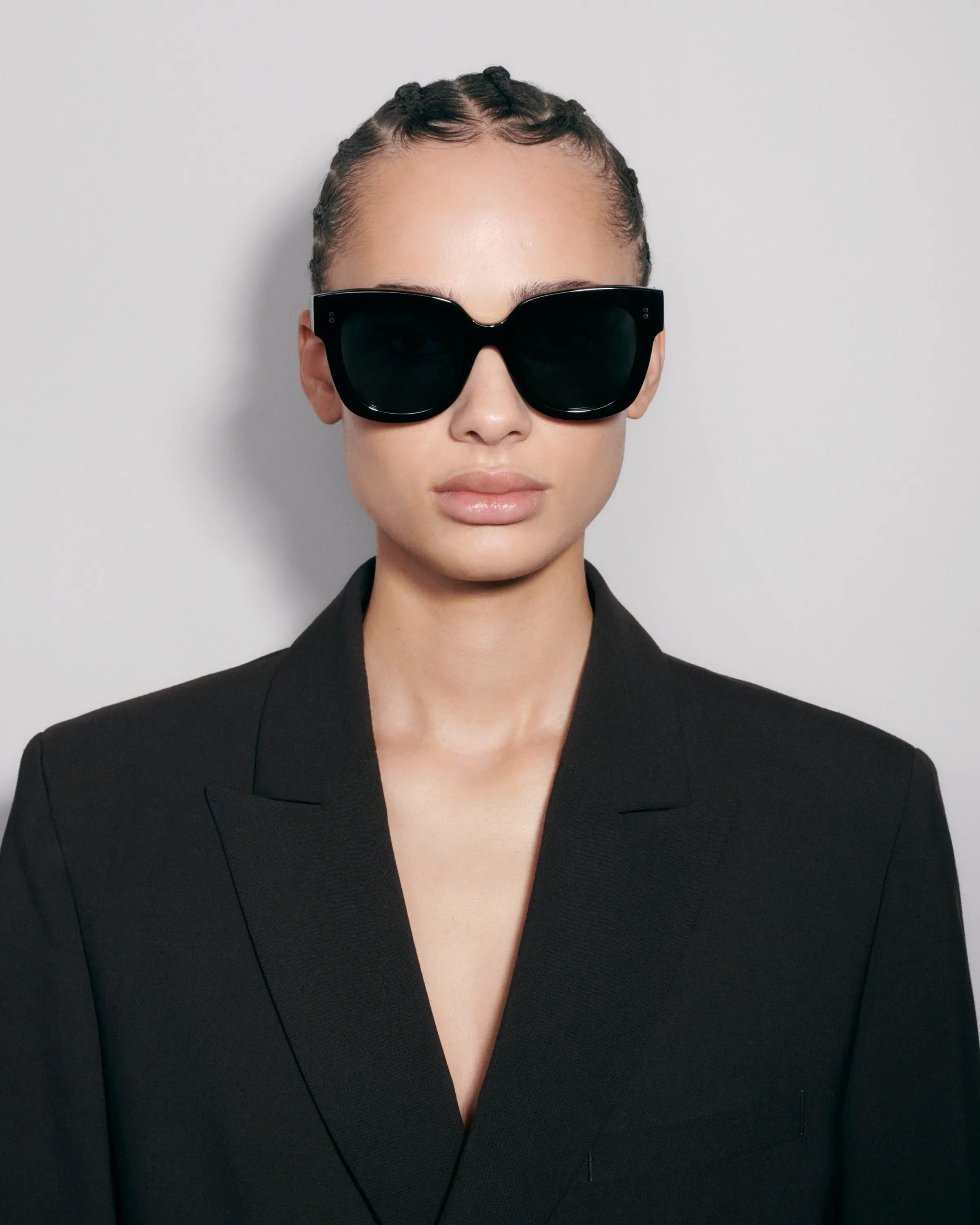 Oversized black sunglasses on model