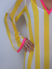 Yellow and white striped v neck dress with pink deatils 