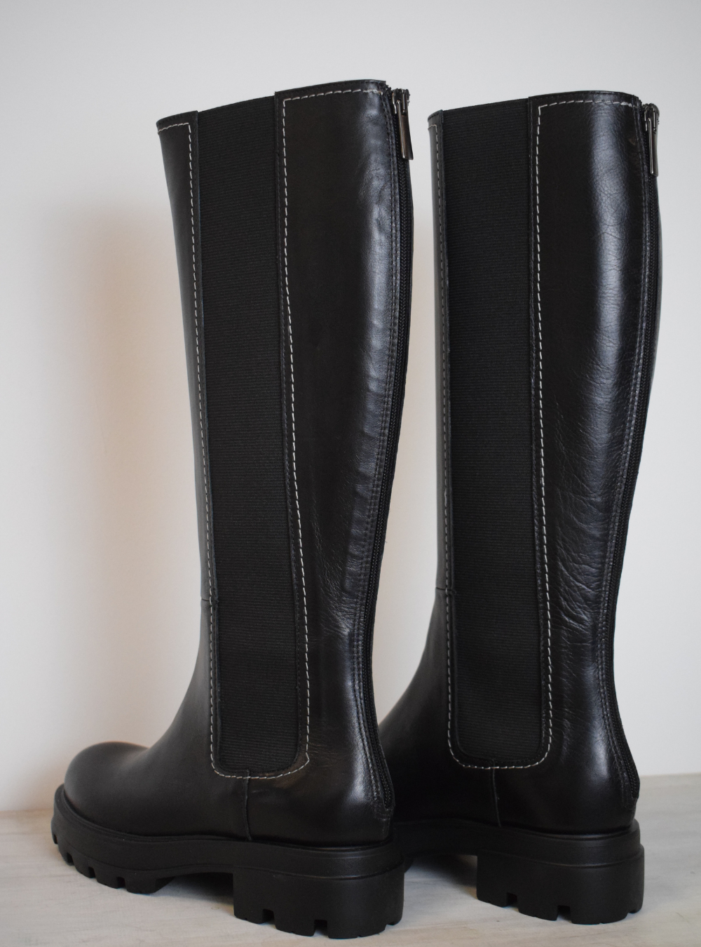 Black boot with white edging 