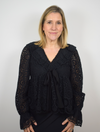 Black lace top with long sleeves and ruffle details with V neckline lined in the body