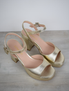 Gold leather platform sandal with ankle strap with buckle fastening