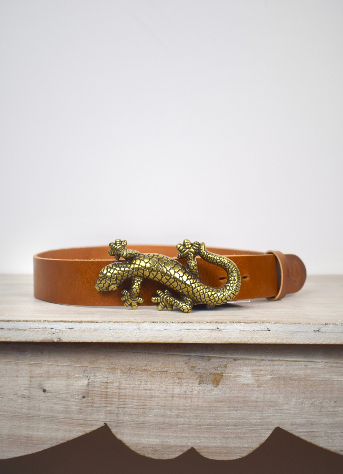 brown belt with gilded bronze salamanda buckle