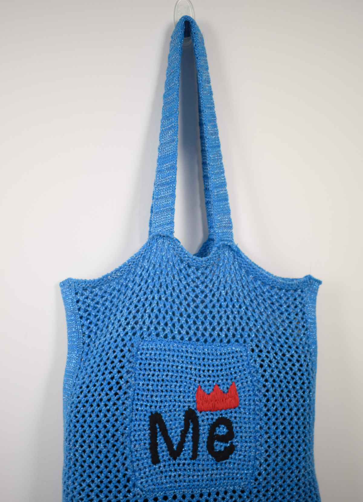 electric blue crochet shopper bag with embodied me on the front 