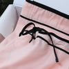 pink pjs Light pink classic pyjama top and long trouser bottoms with black piping detail