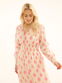 ecru and neon pink print maxi dress with long sleeves and V neck with shirred waist