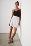 Short white skirt with three layers, lace inserts and a smocked waistband
