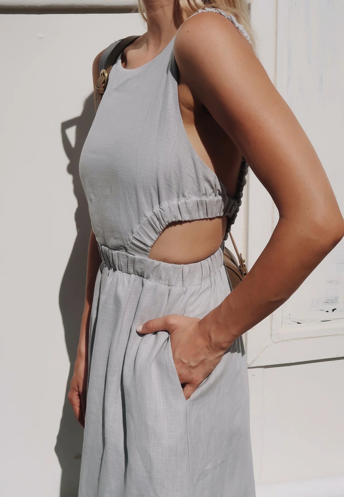 Light grey linen midi dress with high neck and elasticated cut out features with a cross back