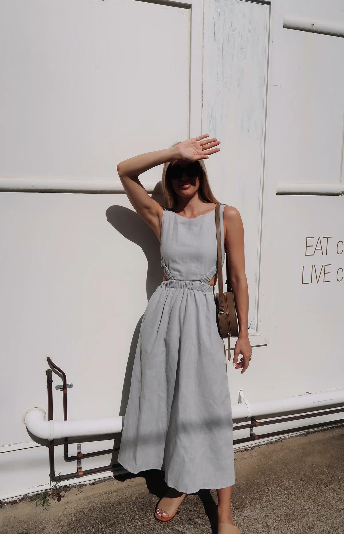 Light grey linen midi dress with high neck and elasticated cut out features with a cross back