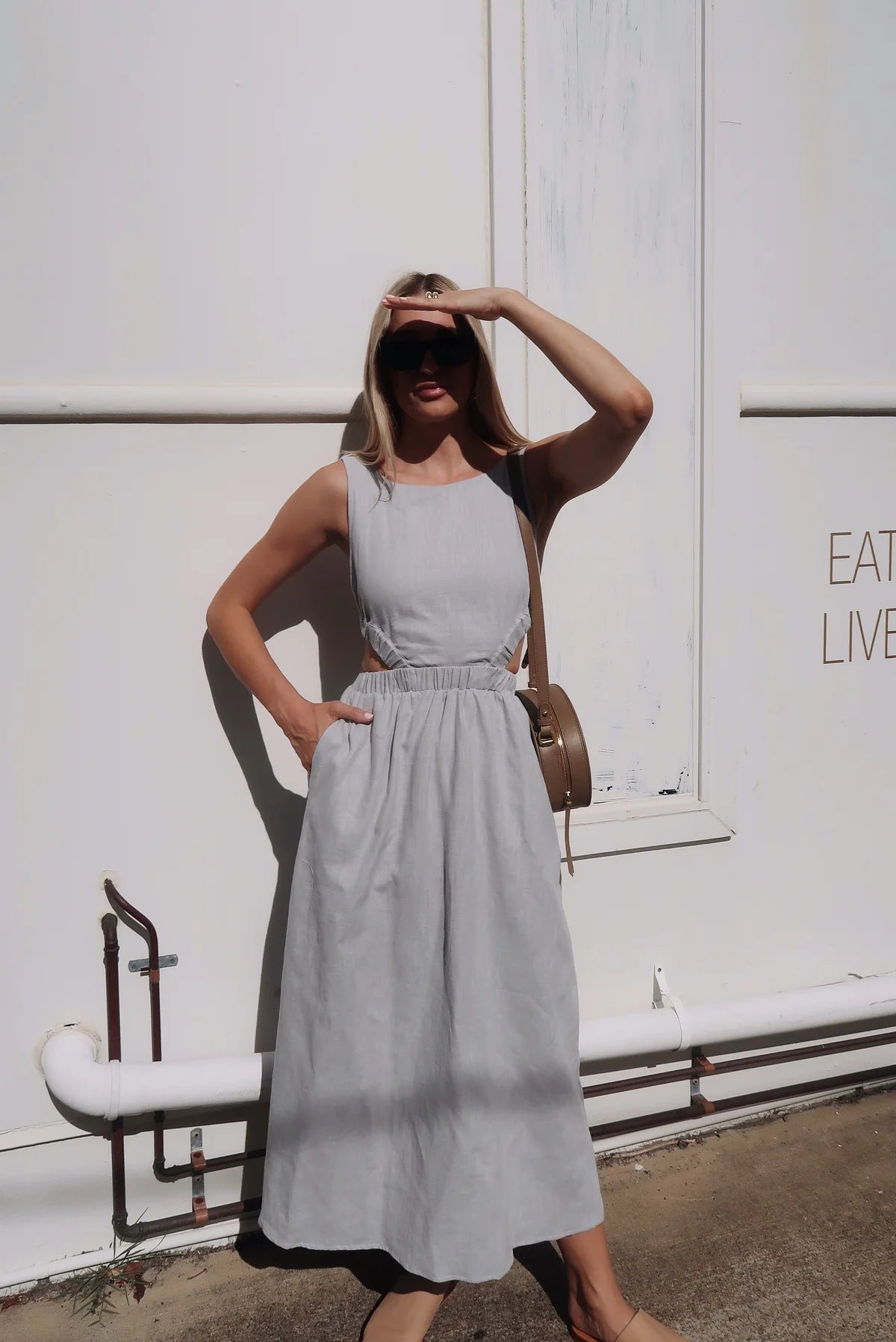 Light grey linen midi dress with high neck and elasticated cut out features with a cross back