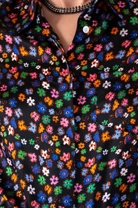 Black classic silk shirt with concealed buttons and bright flowers in blues, green, orange and pink