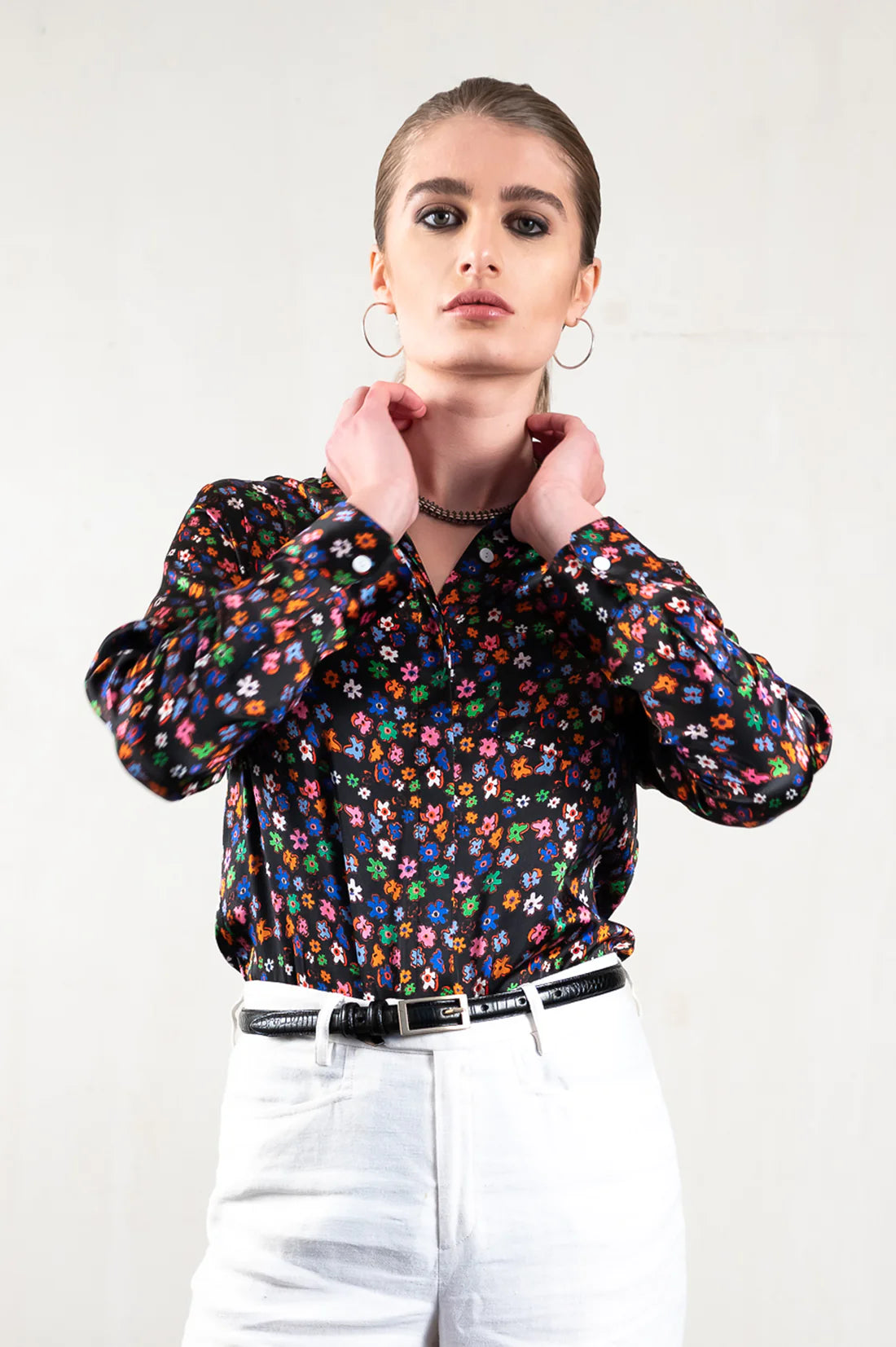 Black classic silk shirt with concealed buttons and bright flowers in blues, green, orange and pink