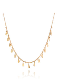 Gold choker necklace with small teardrop shaped gold pendants at regular intervals