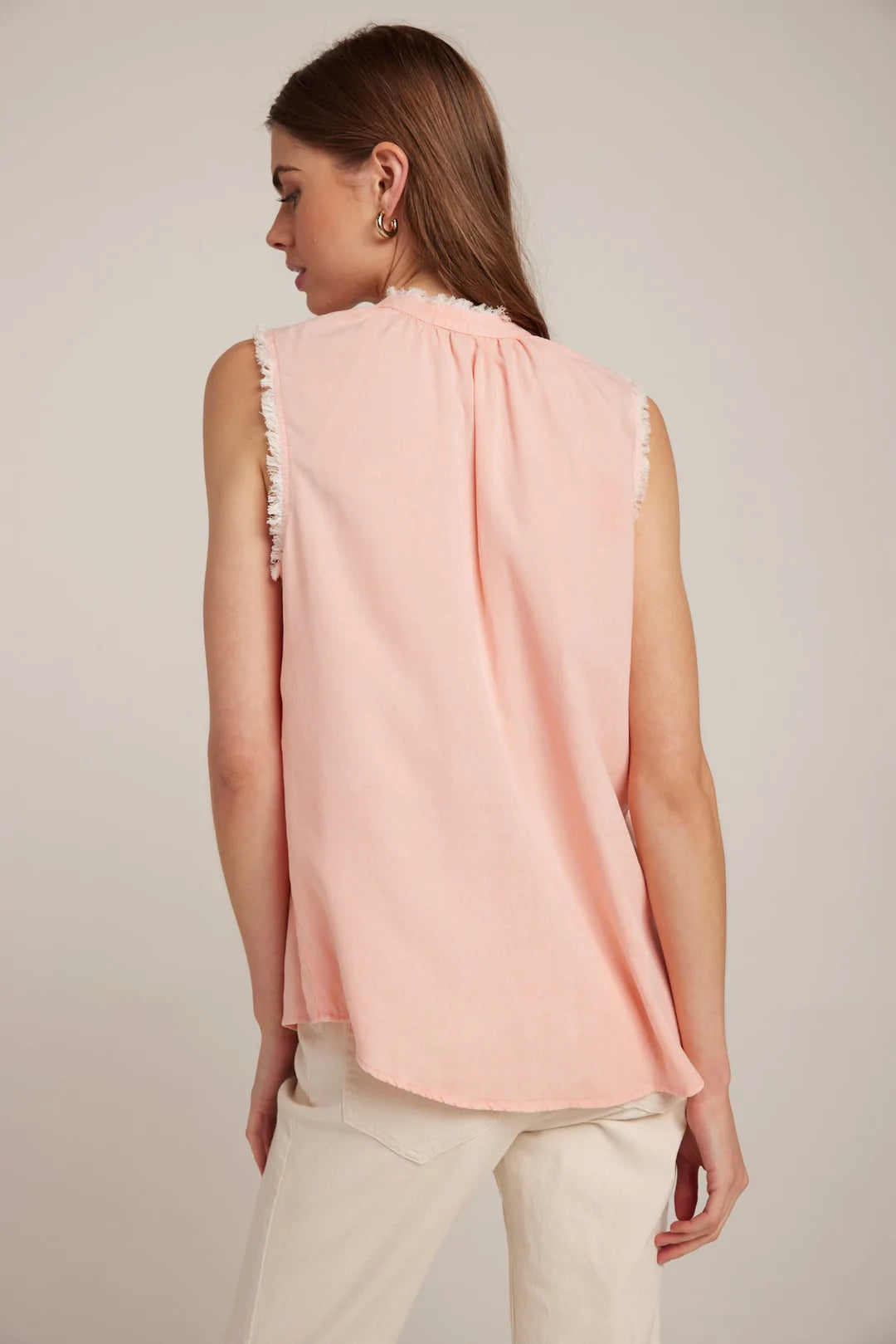 Sleeveless coral top with frayed collar and tie details