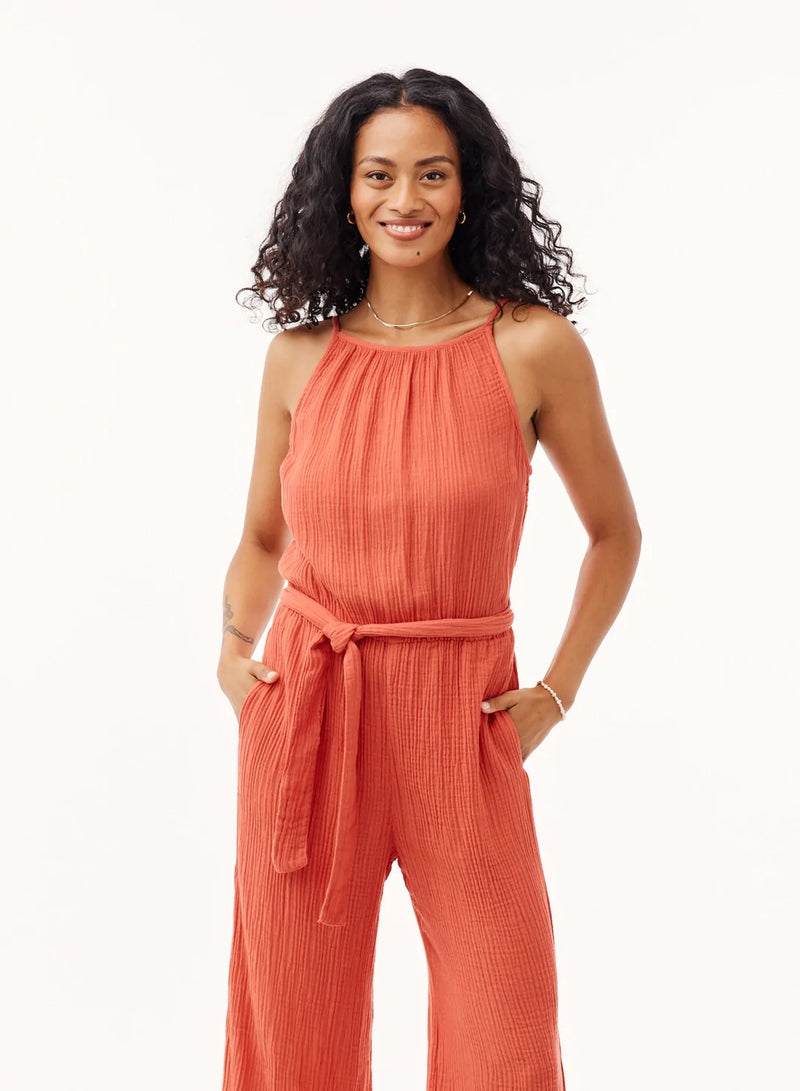 Cheese cloth style jumpsuit with thin adjustable straps, fitted bodice, tie waist and wide leg trousers