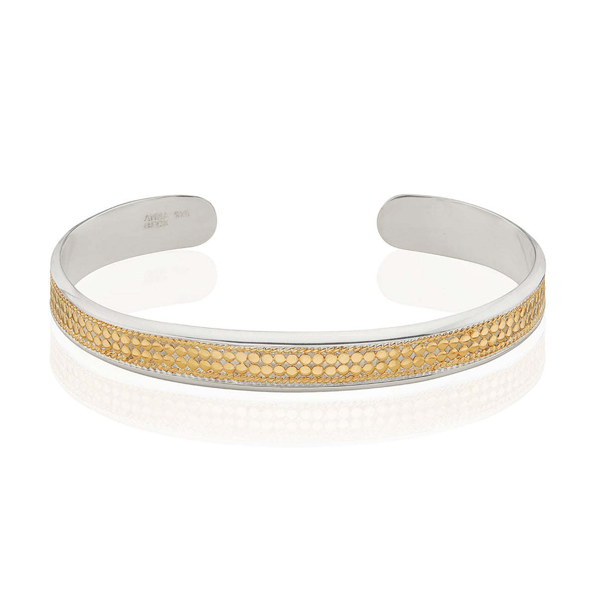 Smooth rim cuff in silver with gold dot detailing