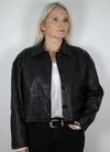 Cropped leather jacket with collar and buttons