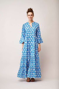 Maxi blue shirt dress with fluted three quarter length sleeves and full length button fastening with white leaf print