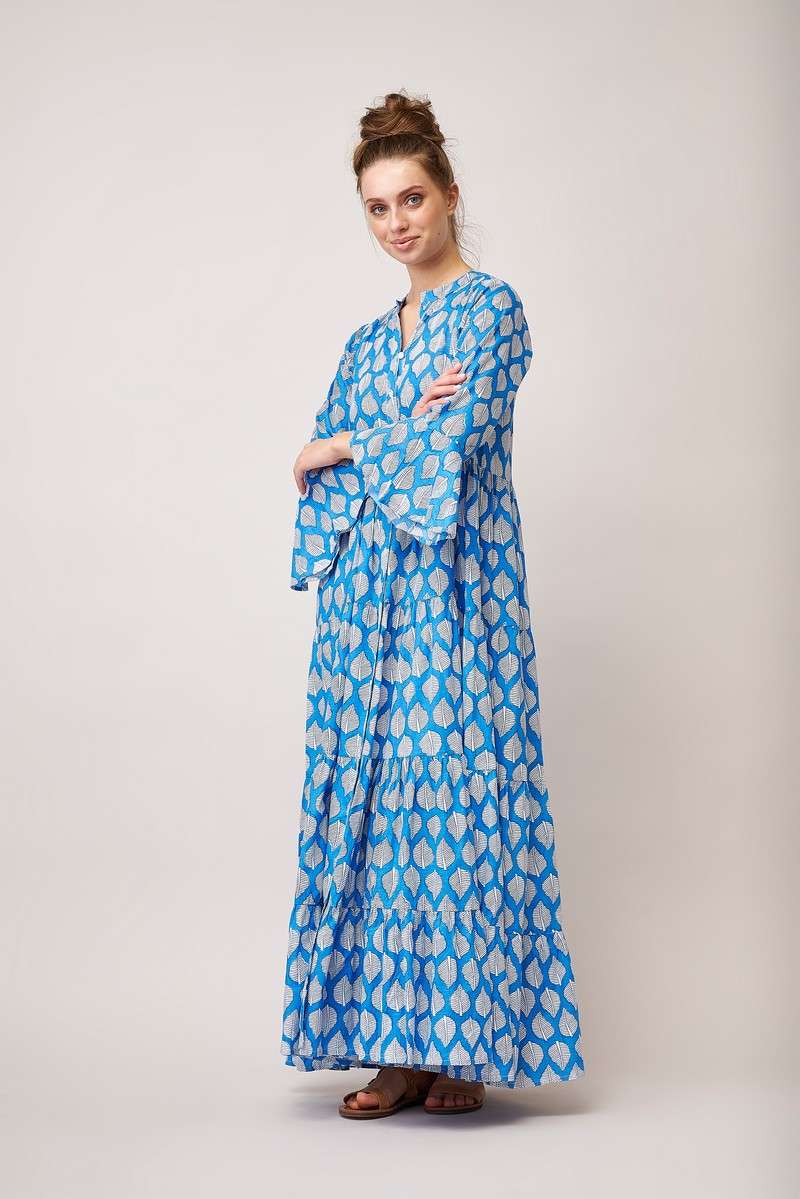Maxi blue shirt dress with fluted three quarter length sleeves and full length button fastening with white leaf print