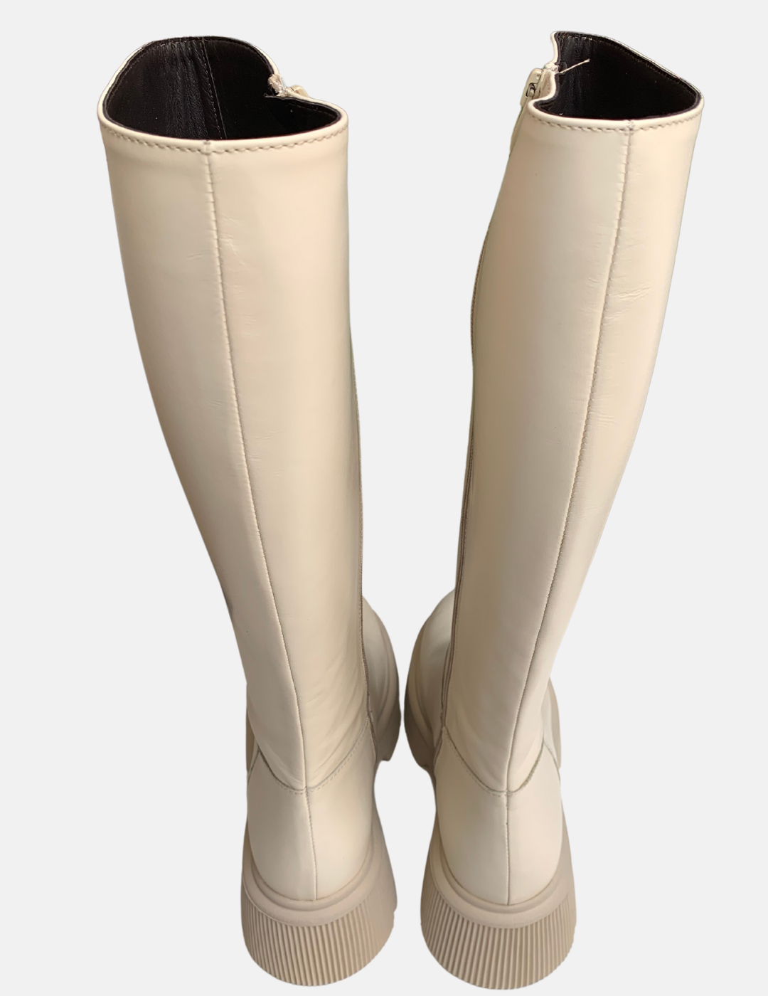 White knee high boots with zip up the side