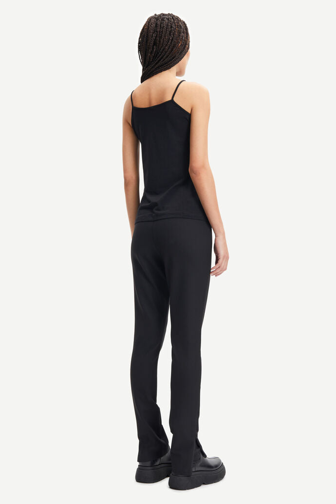 Black vest top with thin straps and a straight hem