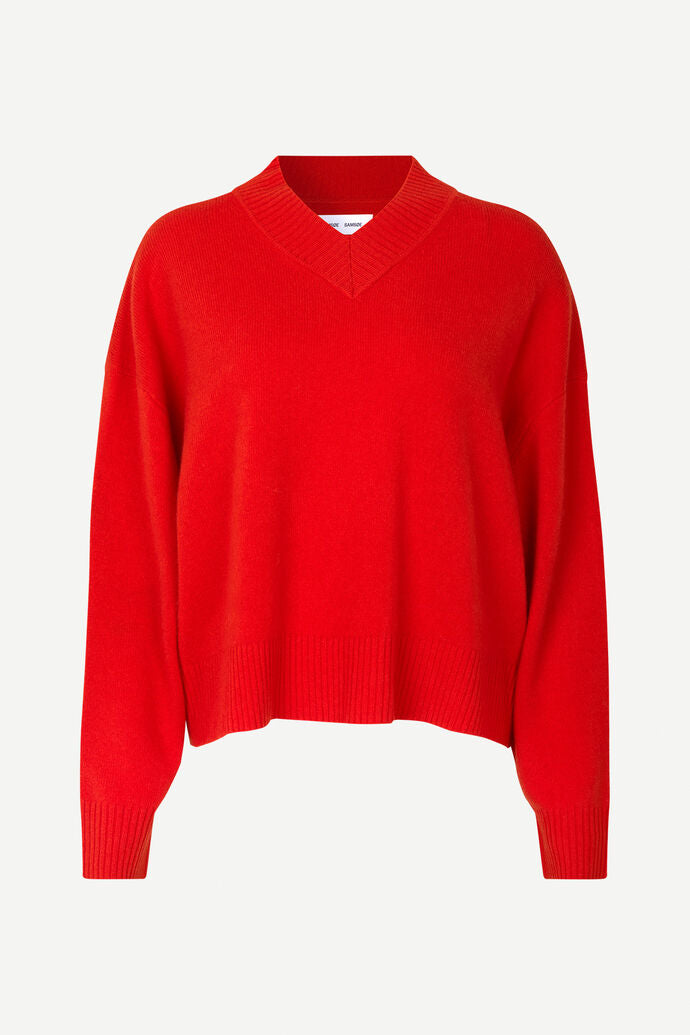 Red V neck wool jumper with long sleeves and ribbed detail