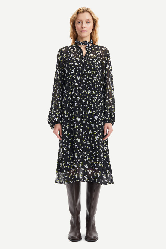 Black chiffon midi dress with tie neck and white and yellow  ditsy floral print long sleeves and tie neck 