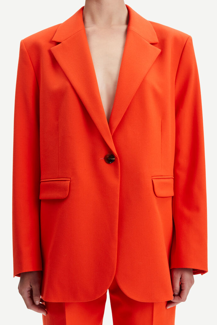 Orange single breasted blazer with single button fastening and long sleeves with two front flap pockets