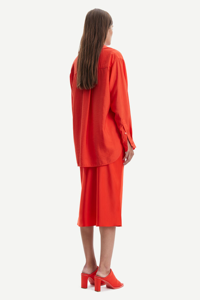 Bright orange sating midi skirt