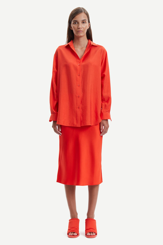 Bright orange sating midi skirt