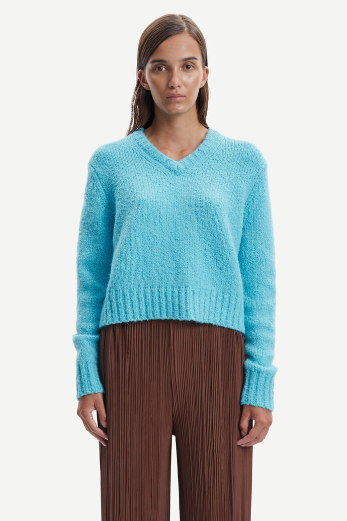 V neck cyan blue cotton and alpaca blend jumper designed to be a neater fit with chunky yarn