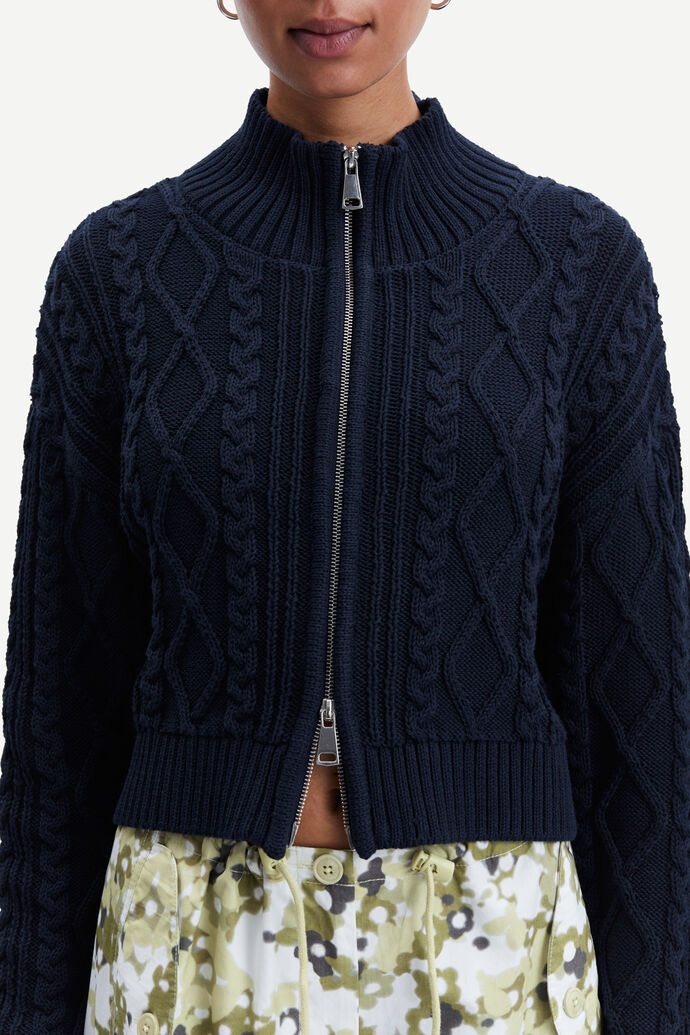 Navy cable knit turtleneck cardigan with two way silver metallic zip