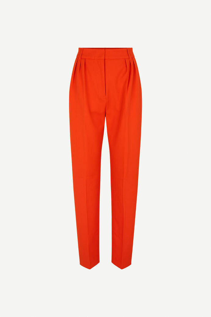 Orange tailored trousers with pleated front and fixed waistband