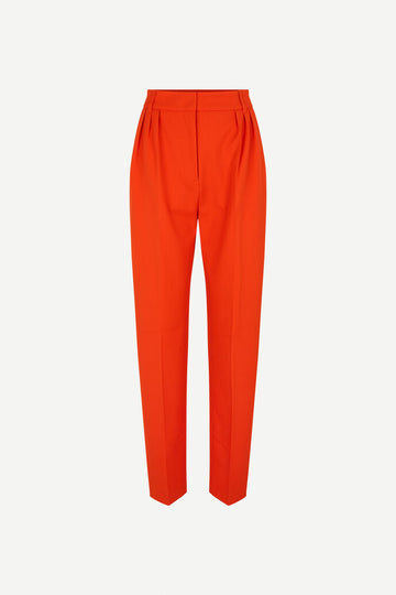 Orange tailored trousers with pleated front and fixed waistband