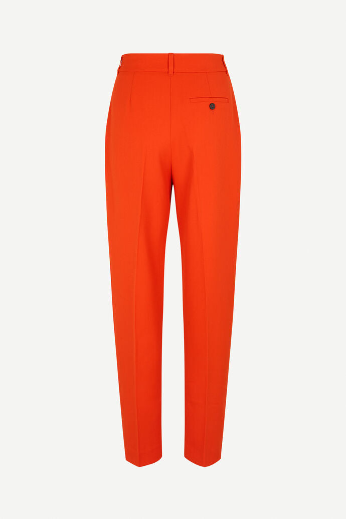 Orange tailored trousers with pleated front and fixed waistband