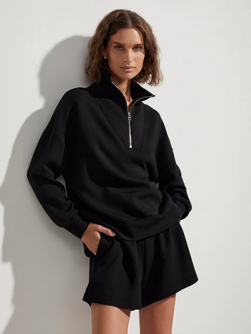 Black half zip long sleeved leisurewear top
