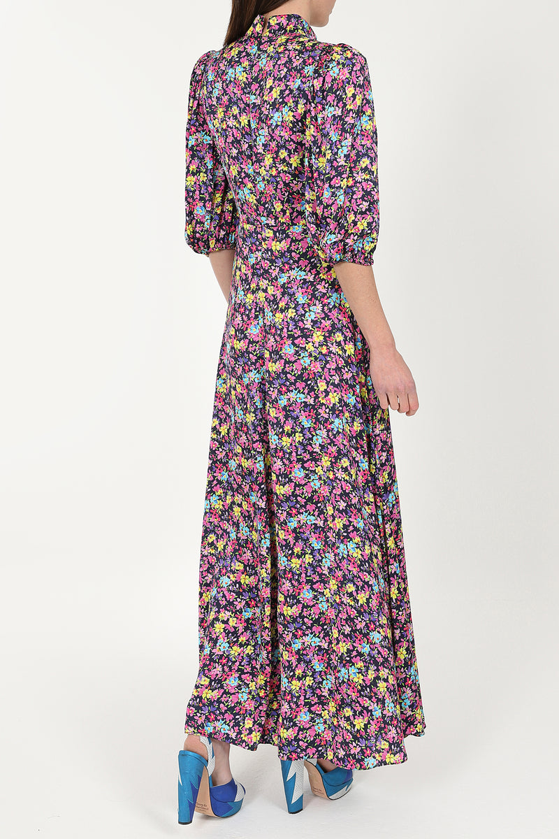 Maxi dress with three quarter length sleeves with a deep navy base and ditsy floral pattern stand up collar and deep V neck and A line skirt