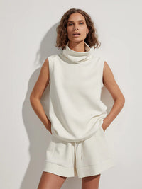 White coloured sleeveless tank over top with roll neck and drawstring waist tie