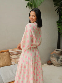 Ecru maxi dress with long sleeves and neon pink print and deep frill with shirred waist
