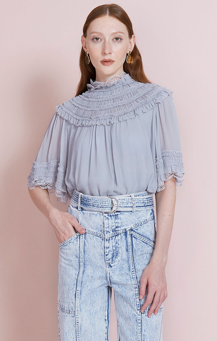 chiffon and lace top with a high neck and rear covered button fastening