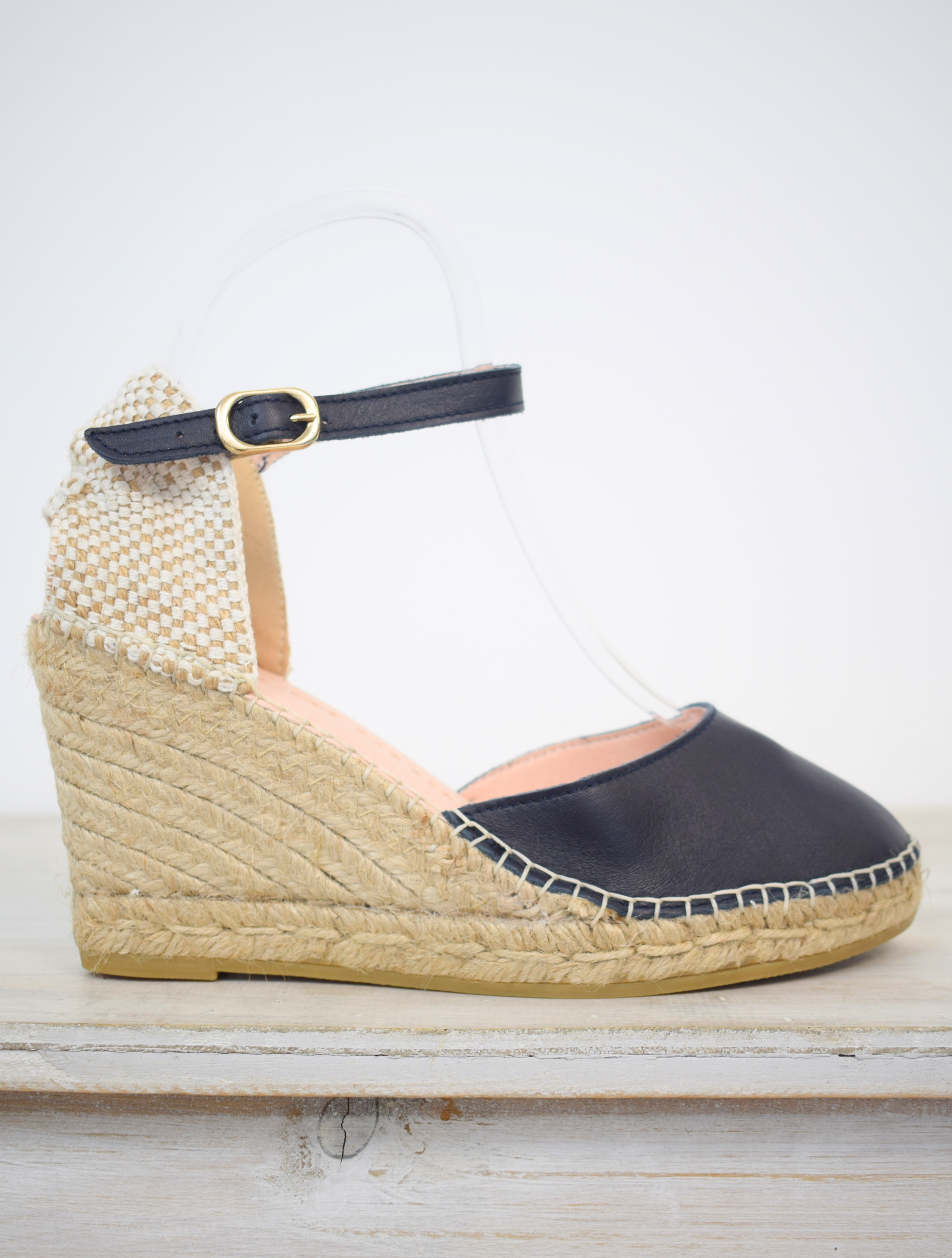 Closed toe navy espadrille with leather upper and strap