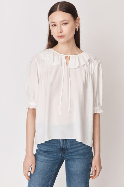 White pull on blouse with ruffle collar and tie detail elbow length sleeves with ruffle detail