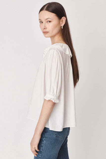 White pull on blouse with ruffle collar and tie detail elbow length sleeves with ruffle detail