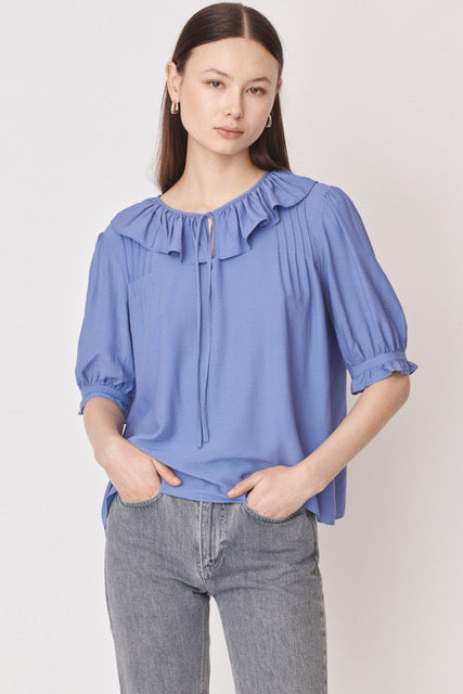 Lilac pull on blouse with ruffle collar and tie neck with short elbow length sleeves and ruffle cuffs