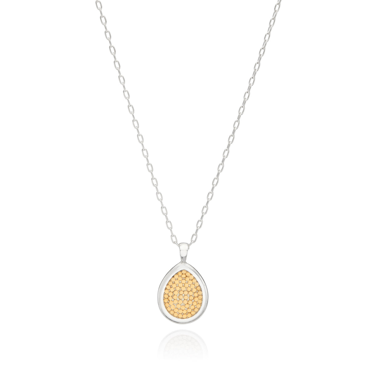 Reversible drop necklace in sterling silver with gold details