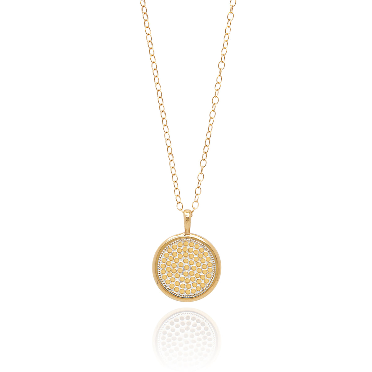 Gold pendant necklace with gold loop chain and circle pendant with delicate gold dot details