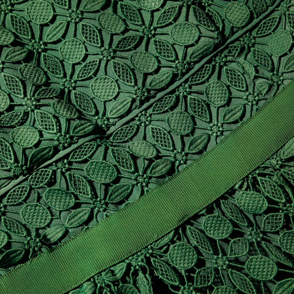 Green lace detail dress with short sleeves full skirt and fabric waistband